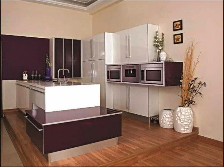 White and purple high-gloss island modular kitchen with breakfast counter